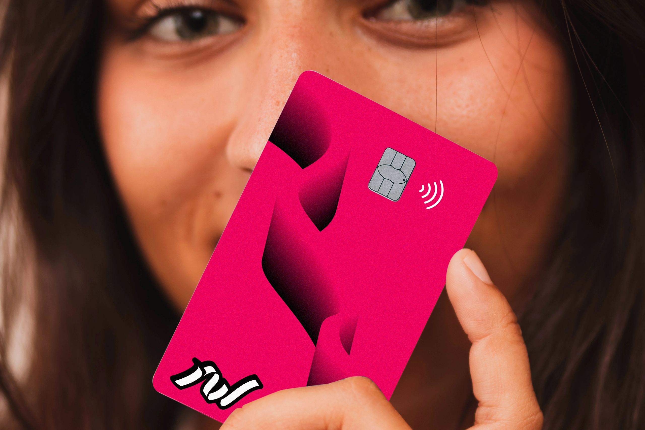 photo of a woman with a Nexwe bank card